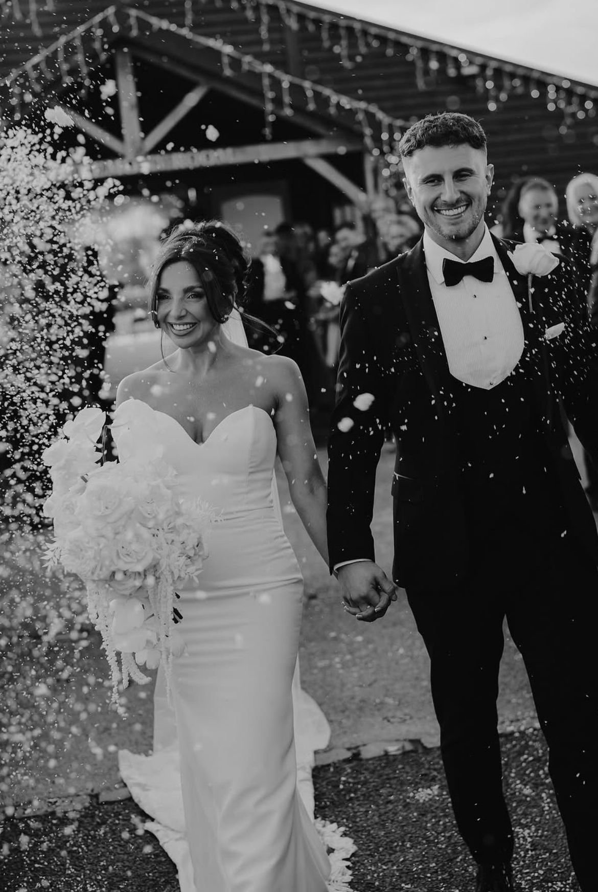 Bride and groom at a wedding with bridal hair styled by Manchester Aesthetics