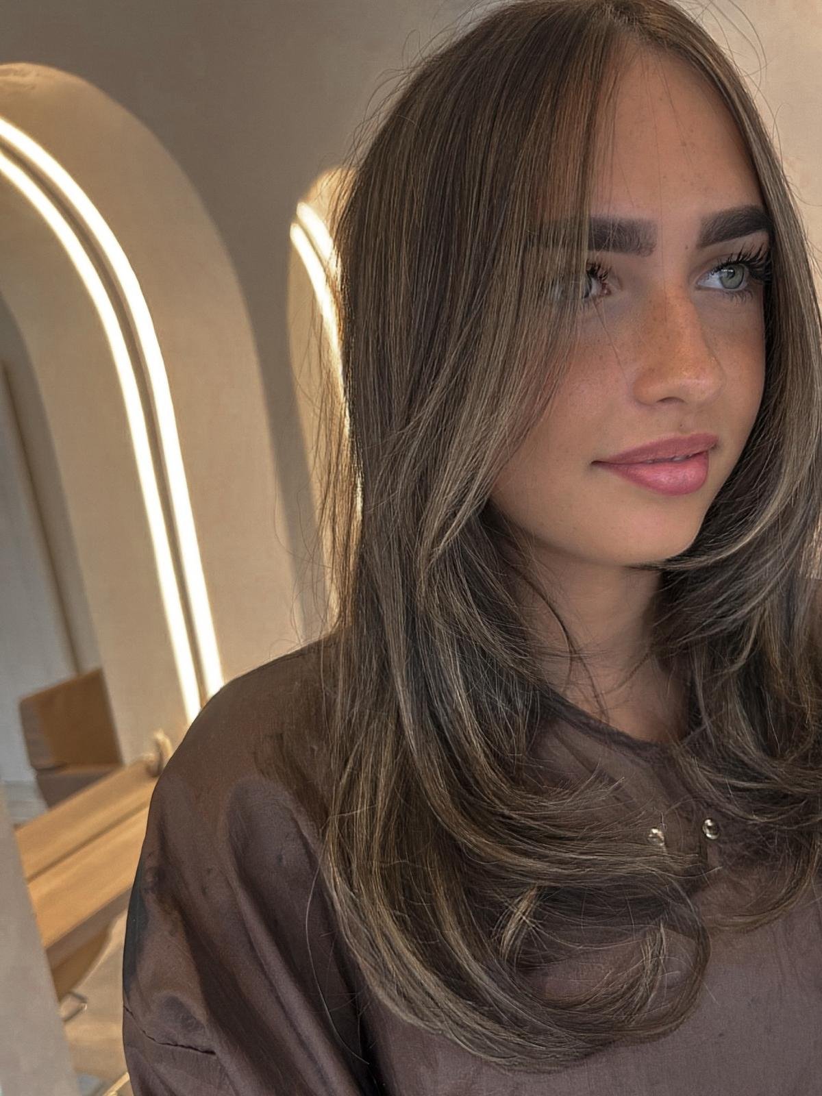 Face frame and tone brunette hair colour at Manchester Aesthetics.